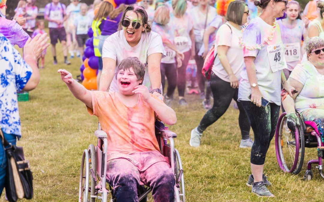 Fundraisers dash through a rainbow of colours and raise an amazing £15,000 for local charity We Are Beams!