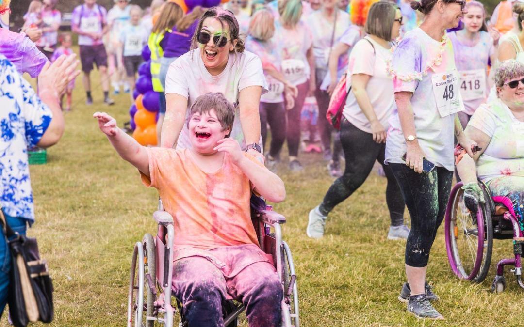 Fundraisers dash through a rainbow of colours and raise an amazing £15,000 for local charity We Are Beams!